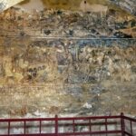 Audience hall view through west arch toward frescos on west wall